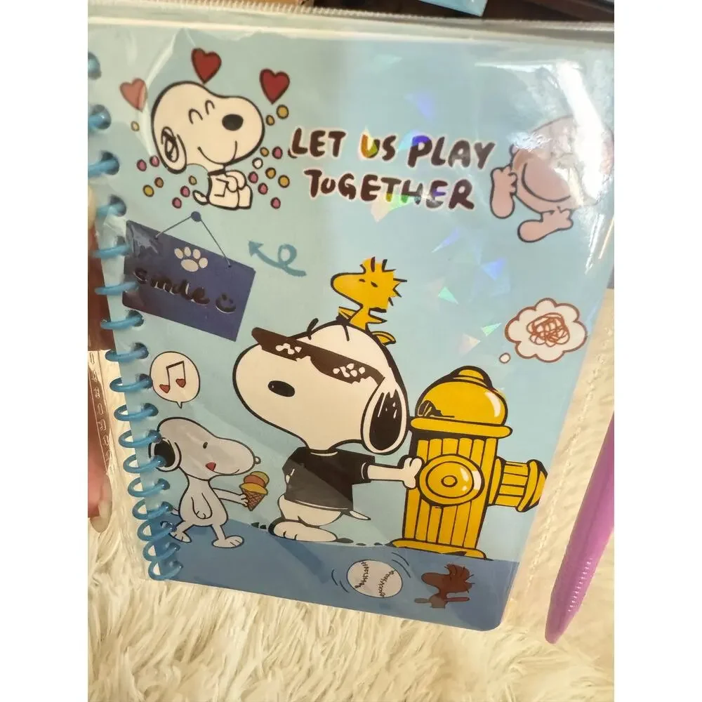 Snoopy blue spiral notebook with designs and a pen size A6